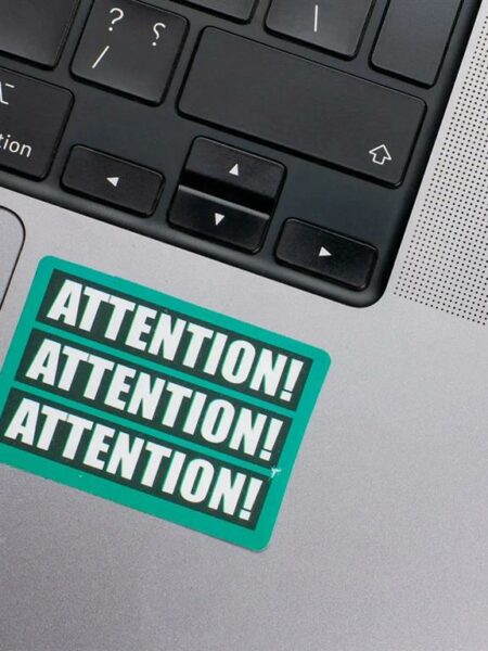Attention Laptop Sticker